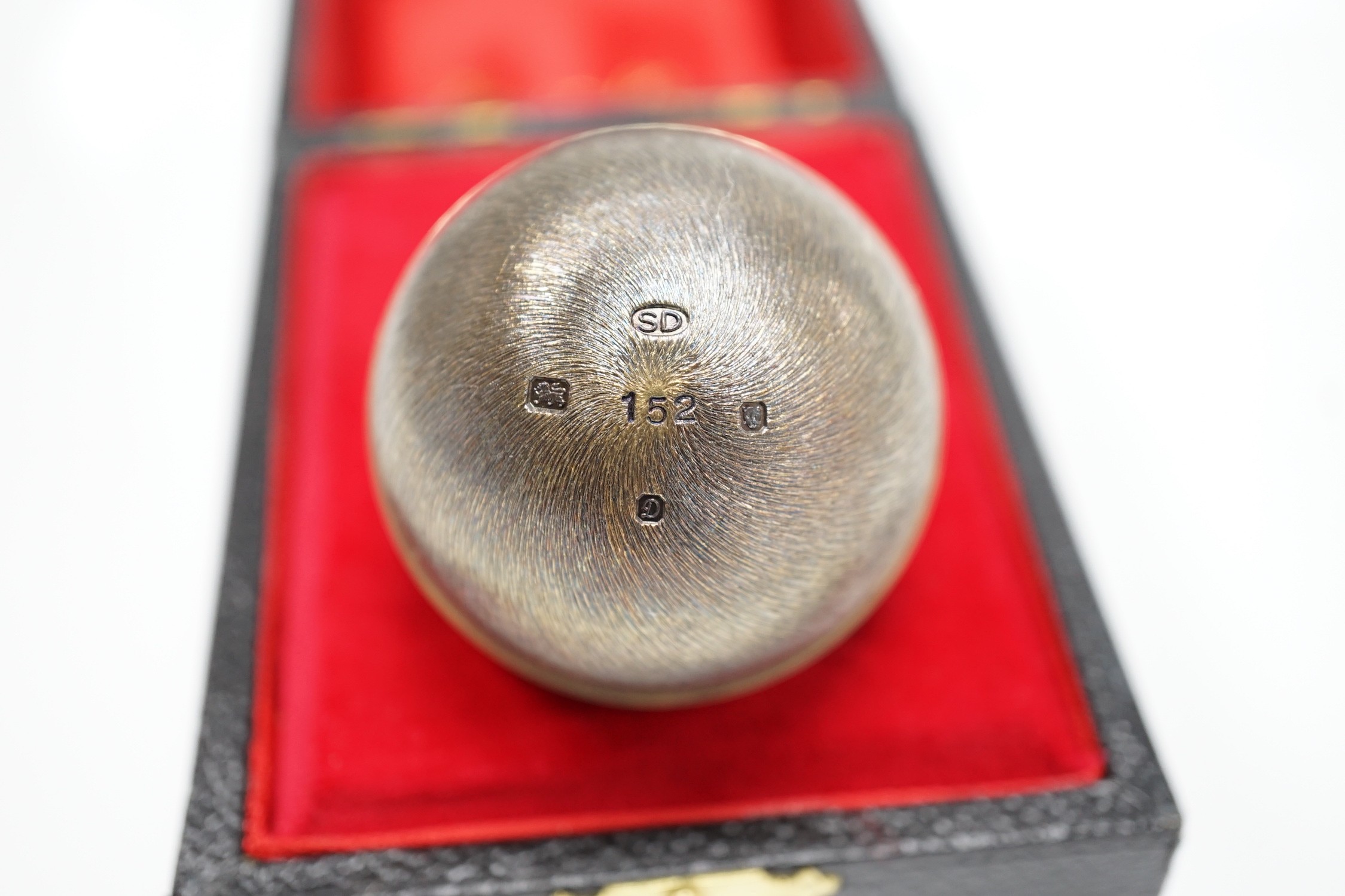 An Elizabeth II Stuart Devlin silver gilt surprise egg, opening to reveal a hedgehog, no. 152, London, 1978, 7cm, in original box.